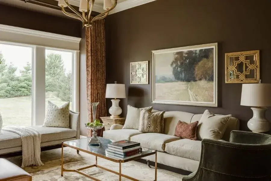 Brown wall living room with light colored furniture
